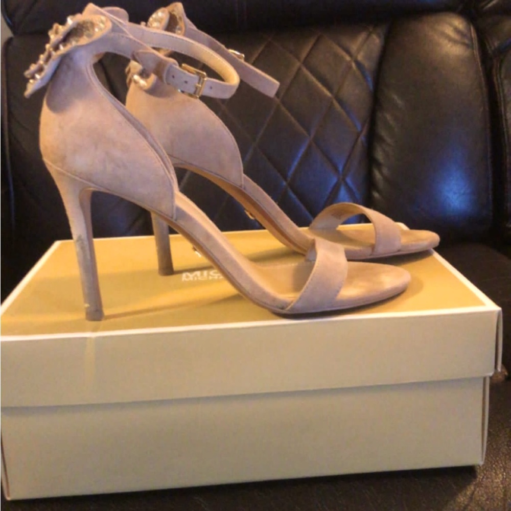 Michael kors butterfly heels size 7m,3 1/2 inches worn a couple of times.